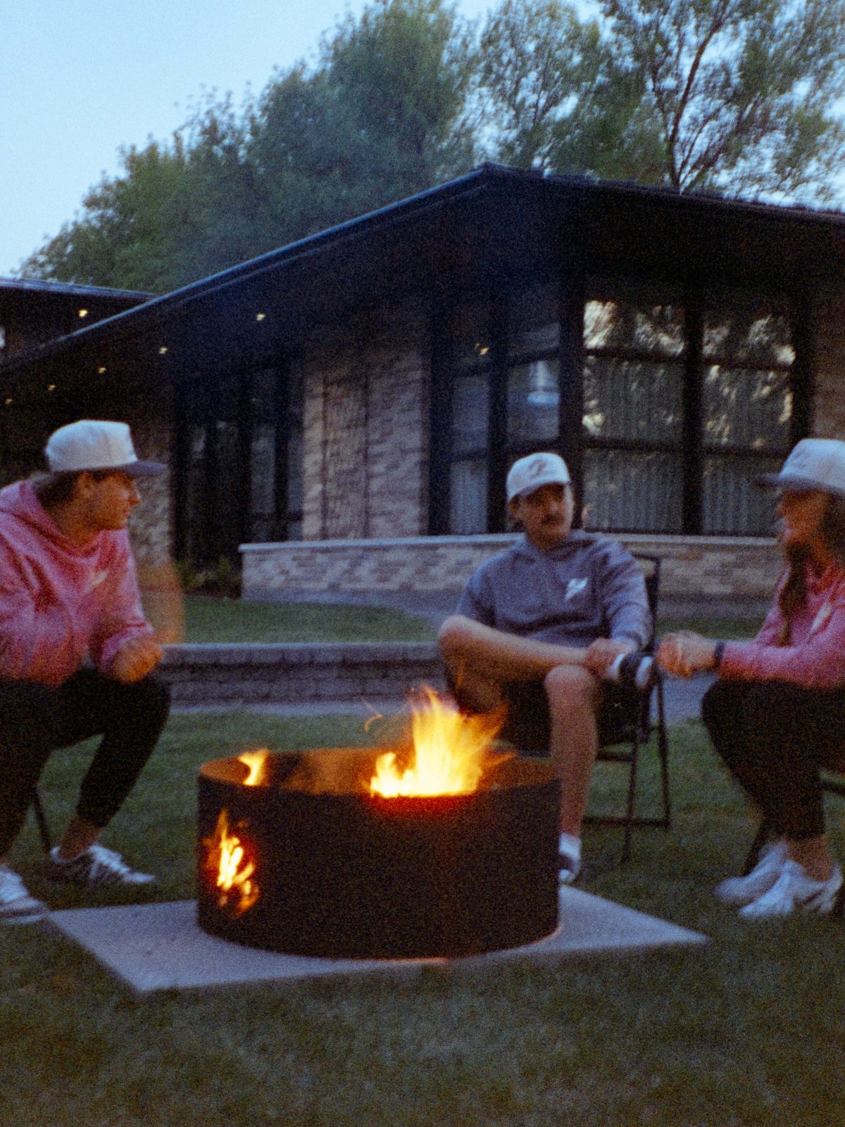 Make Room Sale: friends around a campfire at the lodge in NOBAD hoodies