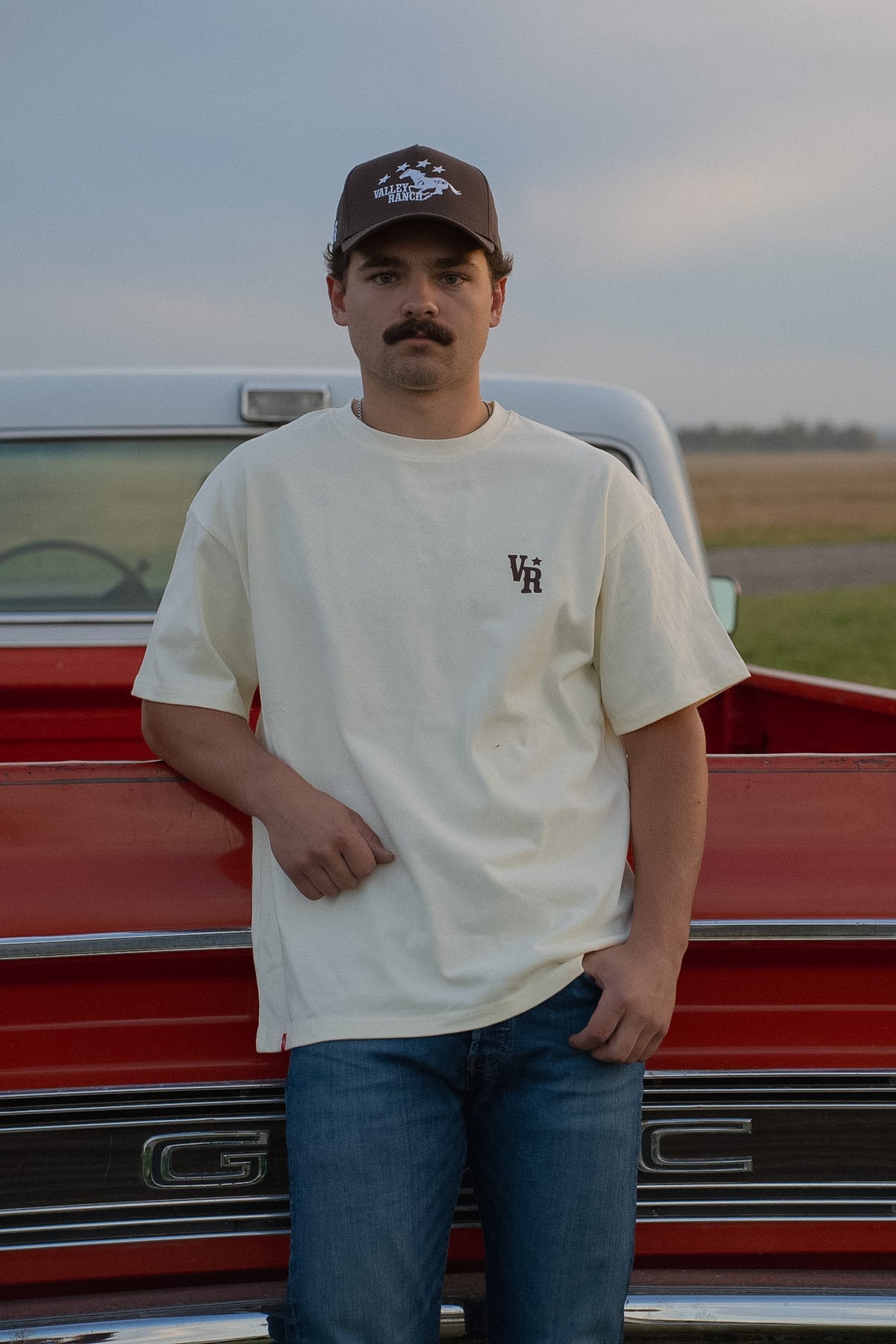 Valley Ranch collection on model by the red truck
